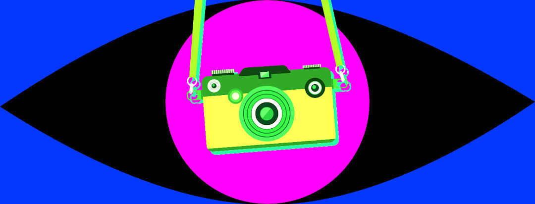 a brightly colored camera hangs in front of the shape of an eye